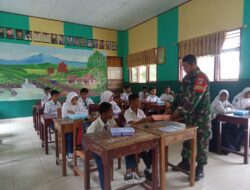 Babinsa Koramil 1315-02/Limboto Dampingi Pendistribusian Makan Bergizi Gratis Di Sekolah Wilayah Binaan